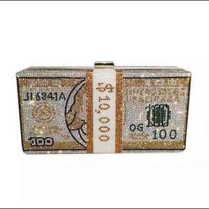 Women’s blinged out clutch/purse in Gold.